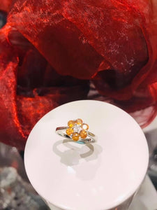 9 carat white and cluster set with yellow sapphires & diamond centre.