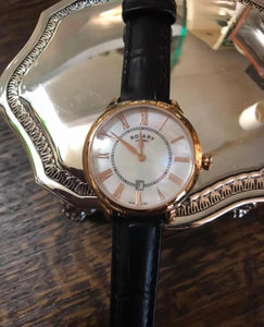 Ladies Rotary Strap Watch beautiful Mother of Pearl dial , with rose Roman Numerals.