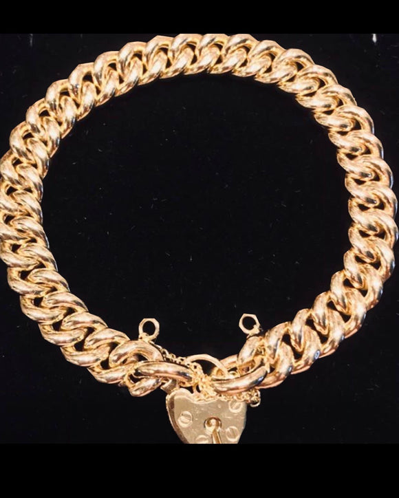 Beautiful 9 carat gold curb link bracelet with padlock
